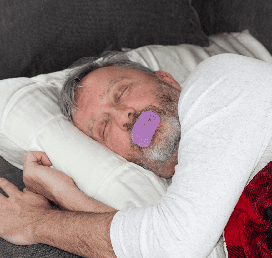 Man sleeping with mouth tape applied